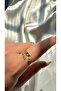 Woman's gold color stone and butterfly ring