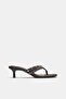 Heeled sandals with studs
