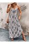 Women's v-neck, button-front, patterned, long sleeve supreme dress with spaghetti straps.