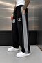 Black 10 returned baggy trackpants