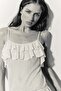 Flounced pointelle-knit top