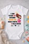 Baby Bodysuit with the Words "I Have a Birtane Aunt Thanks to Whom I Have a Father" Written on It.