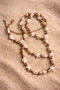 Beach-themed waist necklace belt accessory designed with real seashells.