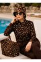 The woman wears a hijab swimsuit. - 3