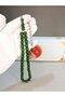 Green spinning amber rosary