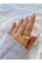 Woman's gold color spiral stone heart ring