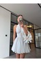 Mini Dress with Gold Accessories That Goes Around the Neck