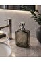 Glass Liquid Soap Dispenser with the Words "Pure Soap" Written on It.