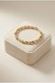 Premium Women's Gold Color Zircon Stone Modern Twist Shuttle Design Bracelet