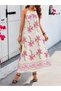 Women's floral print long sleeve supreme dress with spaghetti straps and a straight neckline.