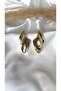 Woman's gold color asymmetric leaf model earrings
