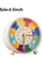 This children's alarm clock helps children learn to tell time. It features a colorful dial, silent operation, and is battery powered. - 2