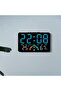 This multi-functional LED clock features a large display screen and can be wall-mounted or placed on a table. It displays the time, day of the week