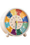 This children's alarm clock helps children learn to tell time. It features a colorful dial, silent operation, and is battery powered.