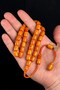 Delightful Knitted Tassel Antique Crimped Amber Prayer Beads