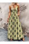 Women's v-neck, button-front, patterned, long sleeve supreme dress with spaghetti straps.