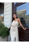 فستان ماكسي مُصمم خصيصًا من قماش الكريب المستورد، مُطرز بالحجر، مُبطن، مع فتحة جانبية.