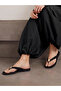 Black Flat Flip-Flops with Gold Tone Metallic Detail - 7