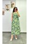 Midi-Length Dress with Wooden Button Detail on the Shoulders, V-Neck at the Back, and a Slit on One Side.