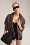 Torce Women's Oversized Brown Sweatshirt with Cut-Out Front, Metal Zipper, Hood, and Label Detail - 5