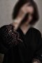 Elena's luxurious black abaya features practical buttons and shimmering embroidery – an elegant design suitable for both special occasions and everyday wear. - 2