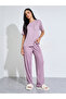 Pink Solid Pocket Detail T-Shirt and All Over Star Print Pants Pyjama Set