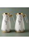 A White Magic Thermos Set With A Transparent Gold Handle, Two Pieces