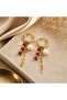 Gold Steel Hoop Earrings with Pearl, Ruby, and Stone Dangle Chain Detail
