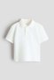 Embroidered-motif piquÃ© polo shirt