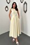 Light yellow halter neck flared dress