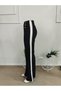 Women's high-waisted, button-front, side-stripe detail, gradually flared imported crepe pants. - 5