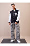Varsity Jacket: Black and White Embroidered Button-Up - 2