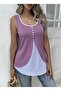 Women's asymmetrical viscose blouse with straps, front button closure, and two-tone detailing.