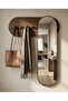 Wall-Mounted Full-Length Mirror with Clothes Rack and Wooden Background