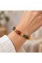 Yellow Brown Beaded Bracelet – Stylish Accessory with Patterned Detail and Bronze Spacer
