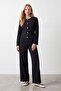 Buttoned suit with belt