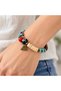 Turquoise Cream Red Beaded Bracelet – Bohemian Accessory with Bronze Triangle Figure