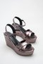 Platinum Crinkled Patent Leather Wedge Heel Platform Sandals with Cross Straps and Ankle Buckle