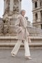 Beige belted coat with fur detail