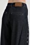 Women's palazzo jeans with full snap detailing at the front - 7