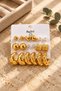 Women's Gold Color 9-Piece Combination Earring Set with Heart Pearl Look and Hoop Model