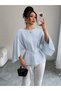 Women's long sleeve crew neck batwing sleeve belted waist satin blouse