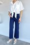 Women's high-waisted denim jeans with tasseled hem