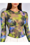 Women's Green and Black Batik Patterned Tulle Blouse with a Bicycle Neckline, Long Sleeves, and Snap Fasteners.