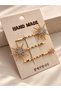 Gold-colored crystal-studded star-shaped 3-piece hair clip set. - 2