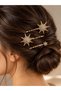 Gold-colored crystal-studded star-shaped 3-piece hair clip set. - 3