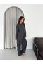 Tunic with a crew neck, long sleeves, and side slits. Elasticated long pants.