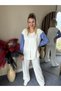 Women's stylish two-piece set with shoulder and hem snap detail, balloon sleeve shirt, and matching pants. - 4