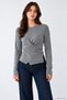 Women's Crew Neck Knit Sweater with Cross-Over Button Detail at the Waist.
