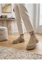 Short Boots with a Studded Upper and Elastic Cuffs.